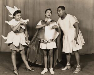 On stage and dressed in attire for Shakespeare's "Midsummer Night's Dream": Butterfly McQueen as Puck, Maxine Sullivan as Titania and Louis Armstrong as Bottom